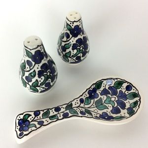 Salt and pepper shakers with spoon holder.